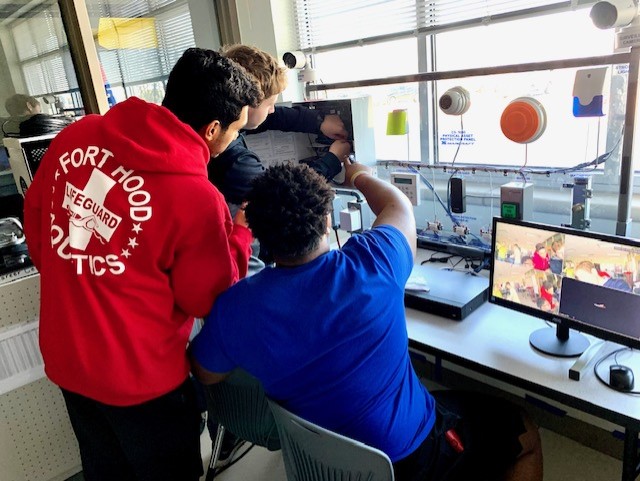 Two students working on the computer